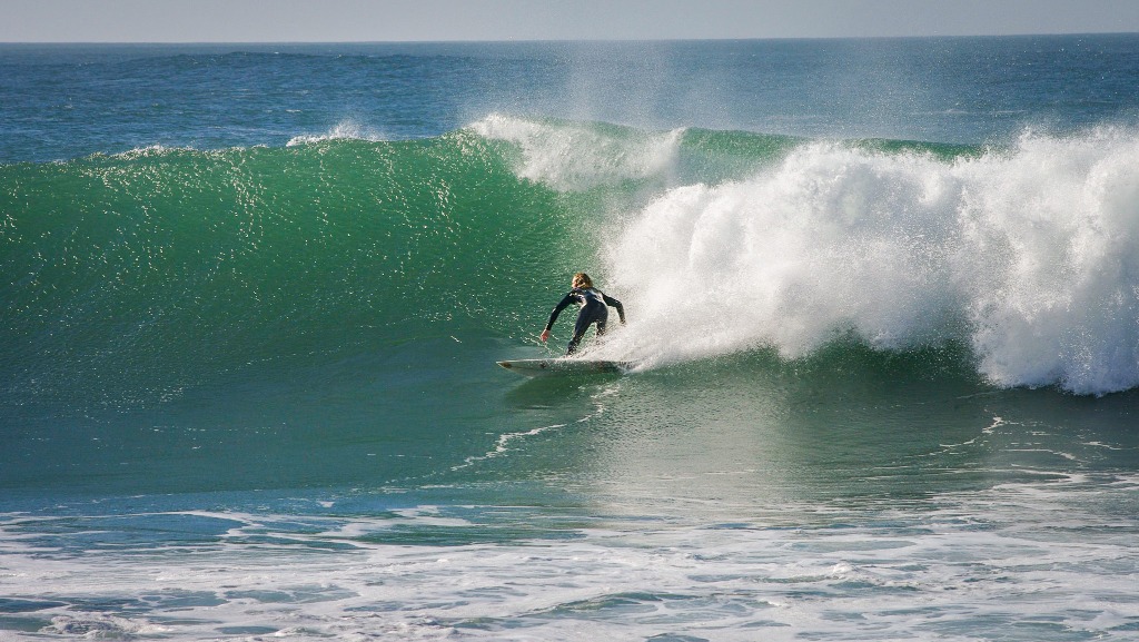 Surfer riding a big wave at Boilers in Taghazout Morocco